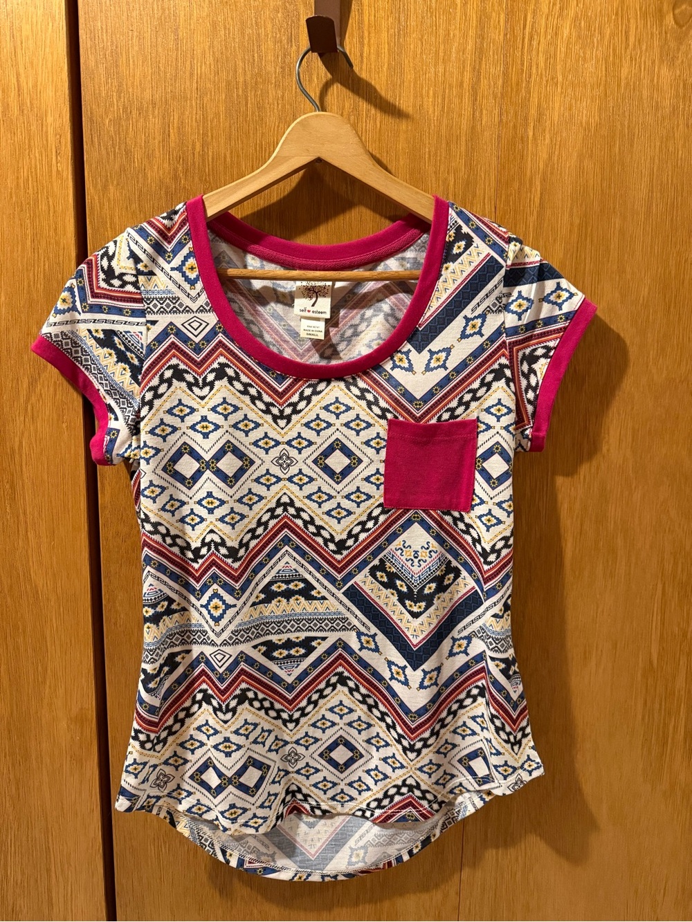 Juniors Aztec Print Short Sleeve Tee with Pink Trim and Pocket Detail